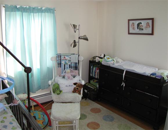 121 Cambridge Road, Unit 3 Woburn, MA 01801 - Photo 20 of 21 a living room with furniture and a window