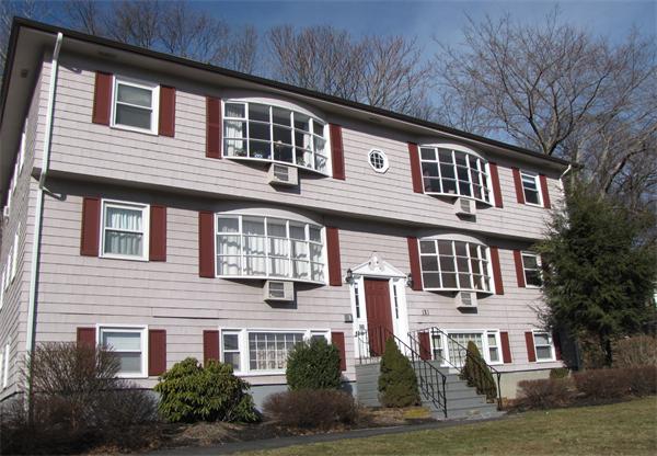 121 Cambridge Road, Unit 3 Woburn, MA 01801 - Photo 2 of 21 a front view of residential houses with yard