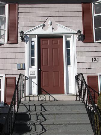 121 Cambridge Road, Unit 3 Woburn, MA 01801 - Photo 3 of 21 a view of a house with a door and wooden floor