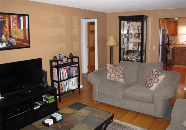 121 Cambridge Road, Unit 3 Woburn, MA 01801 - Photo 5 of 21 a living room with furniture and a flat screen tv