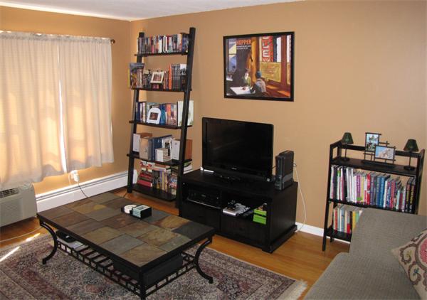 121 Cambridge Road, Unit 3 Woburn, MA 01801 - Photo 7 of 21 a living room with television and a flat screen tv