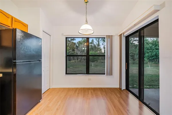 a kitchen with stainless steel appliances granite countertop a refrigerator a stove top oven a sink and dishwasher