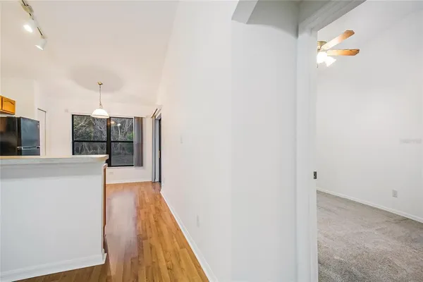 a view of an empty room with a window