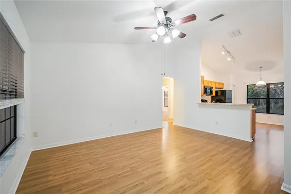 a view of an empty room with a window