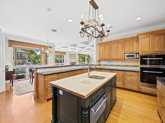 a living room with patio furniture and a floor to ceiling window