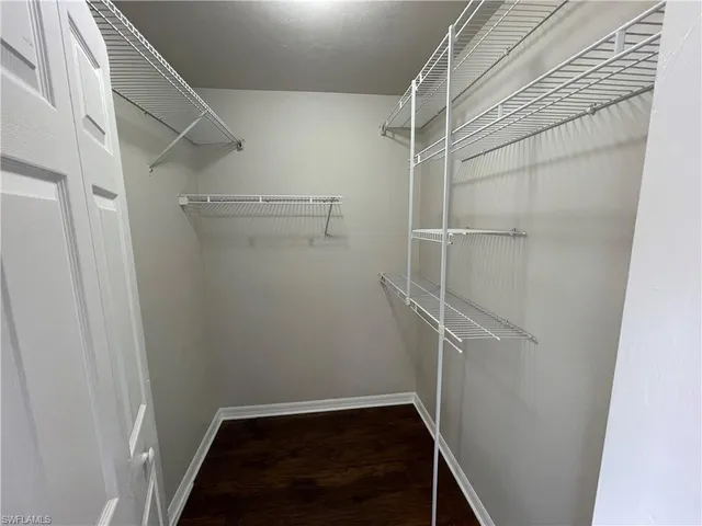 a view of an empty walk in closet