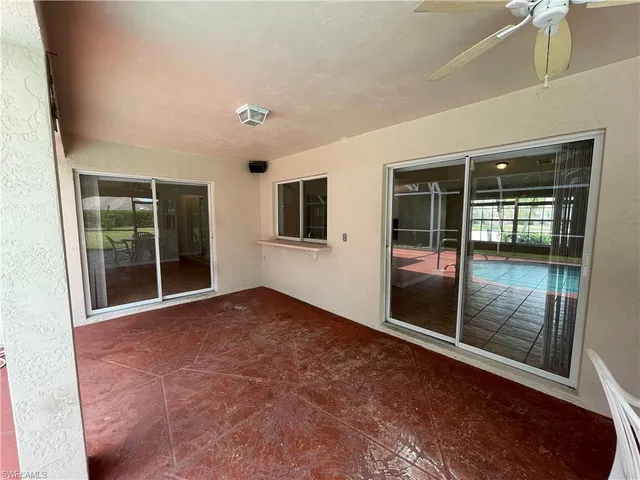 a view of an empty room with glass door