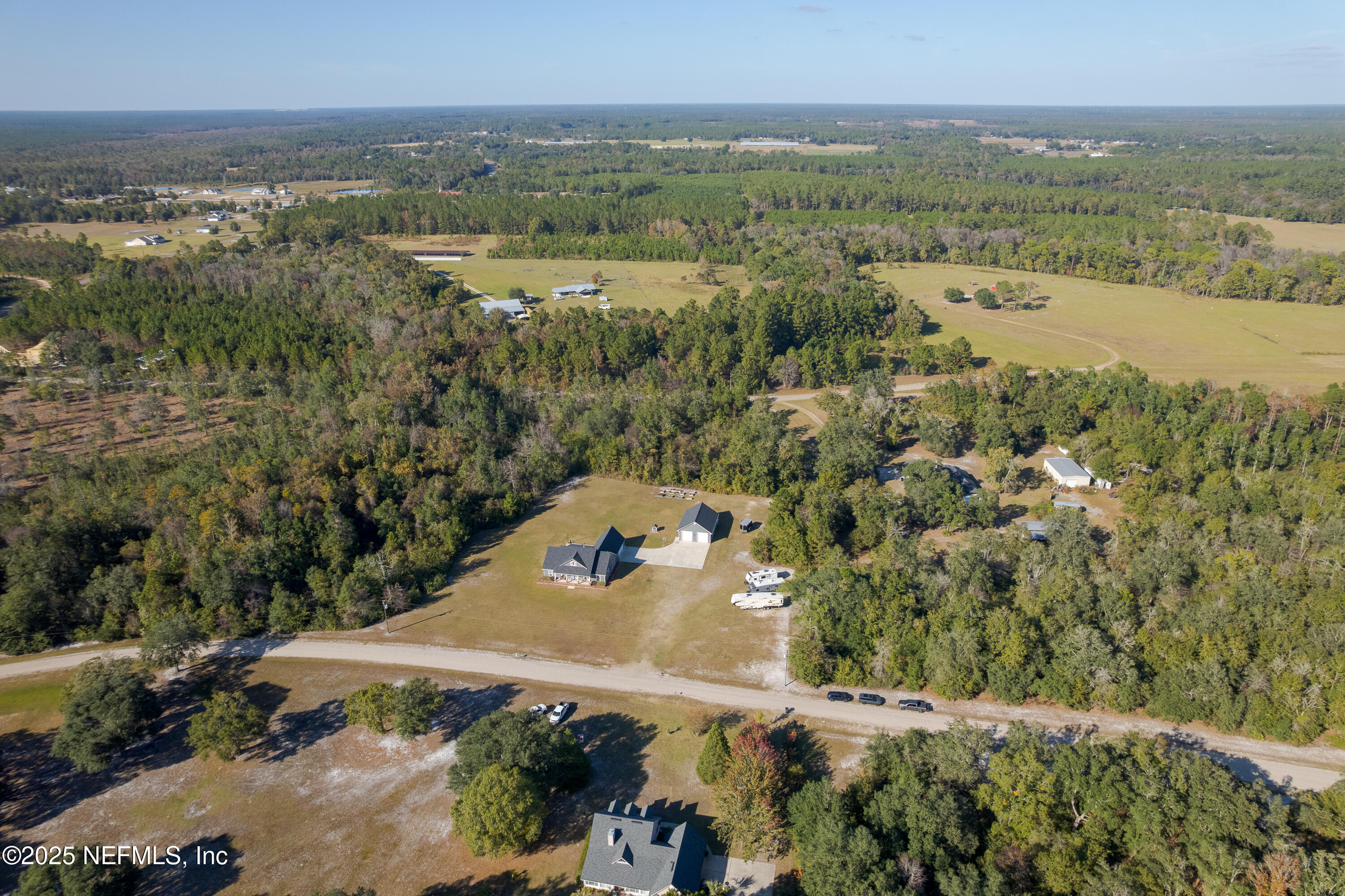 3670 Charles Green Road Hilliard, FL 32046 - Photo 13 of 68 an aerial view of a town with trees