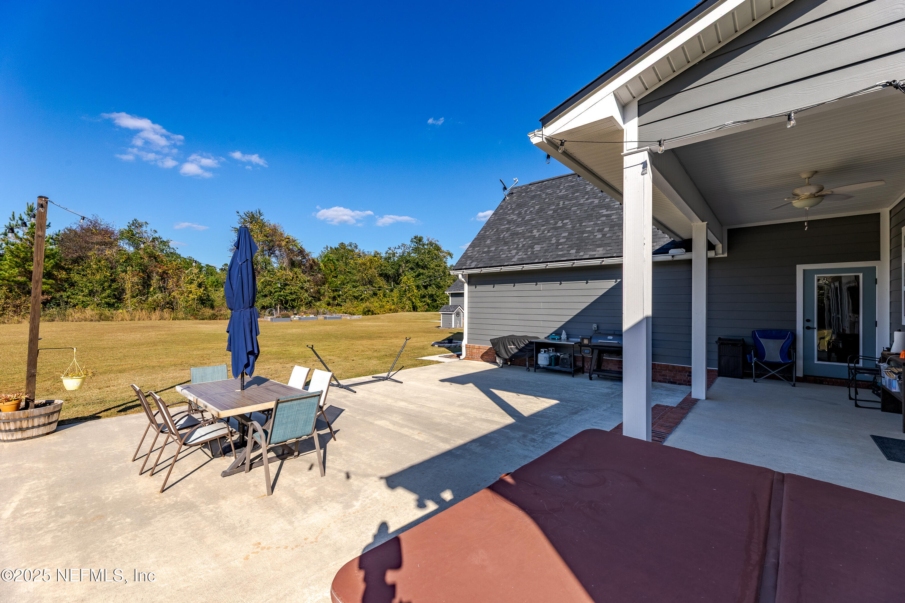 3670 Charles Green Road Hilliard, FL 32046 - Photo 16 of 68 a view of a patio with swimming pool