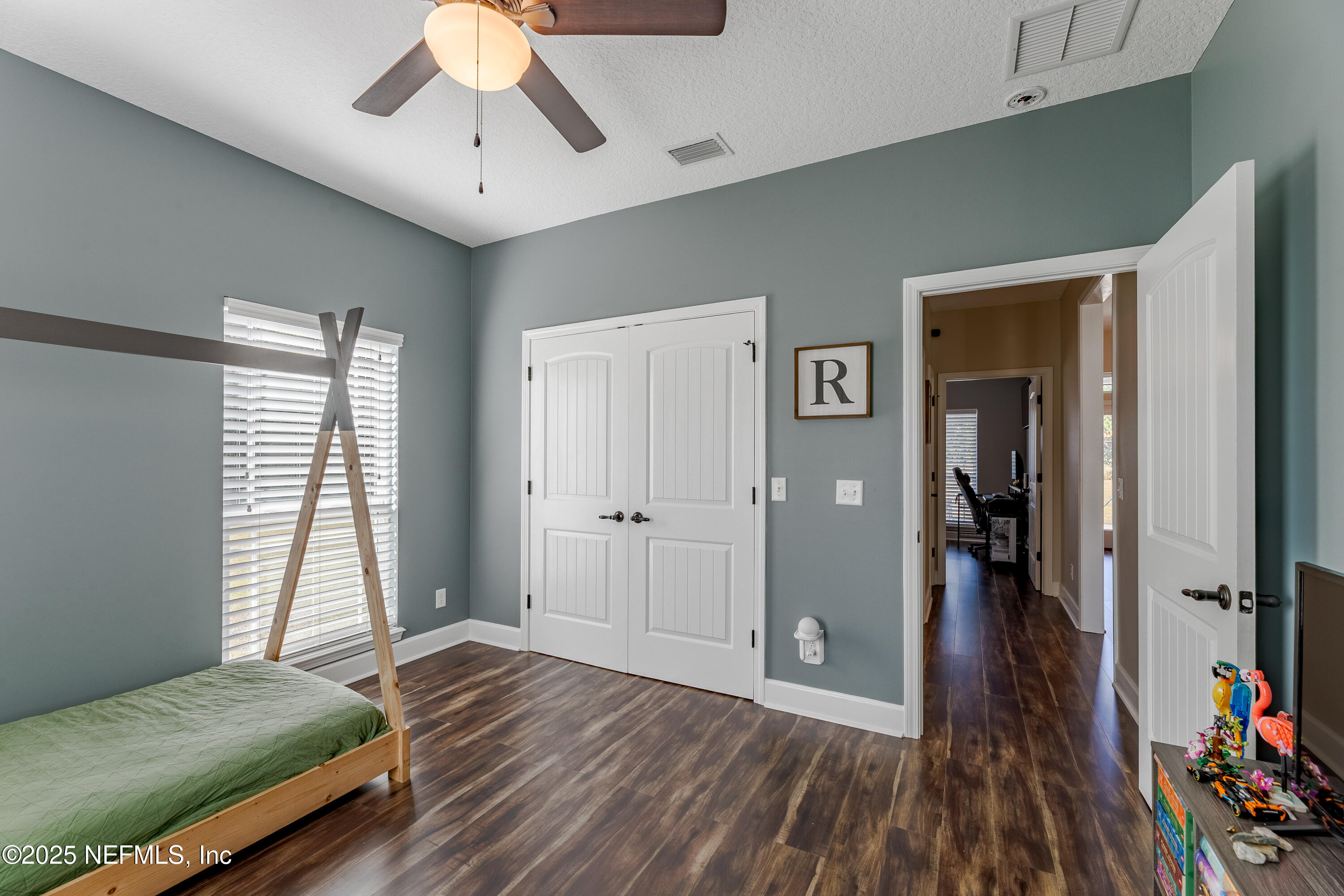 3670 Charles Green Road Hilliard, FL 32046 - Photo 27 of 68 a bedroom with a bed and a window