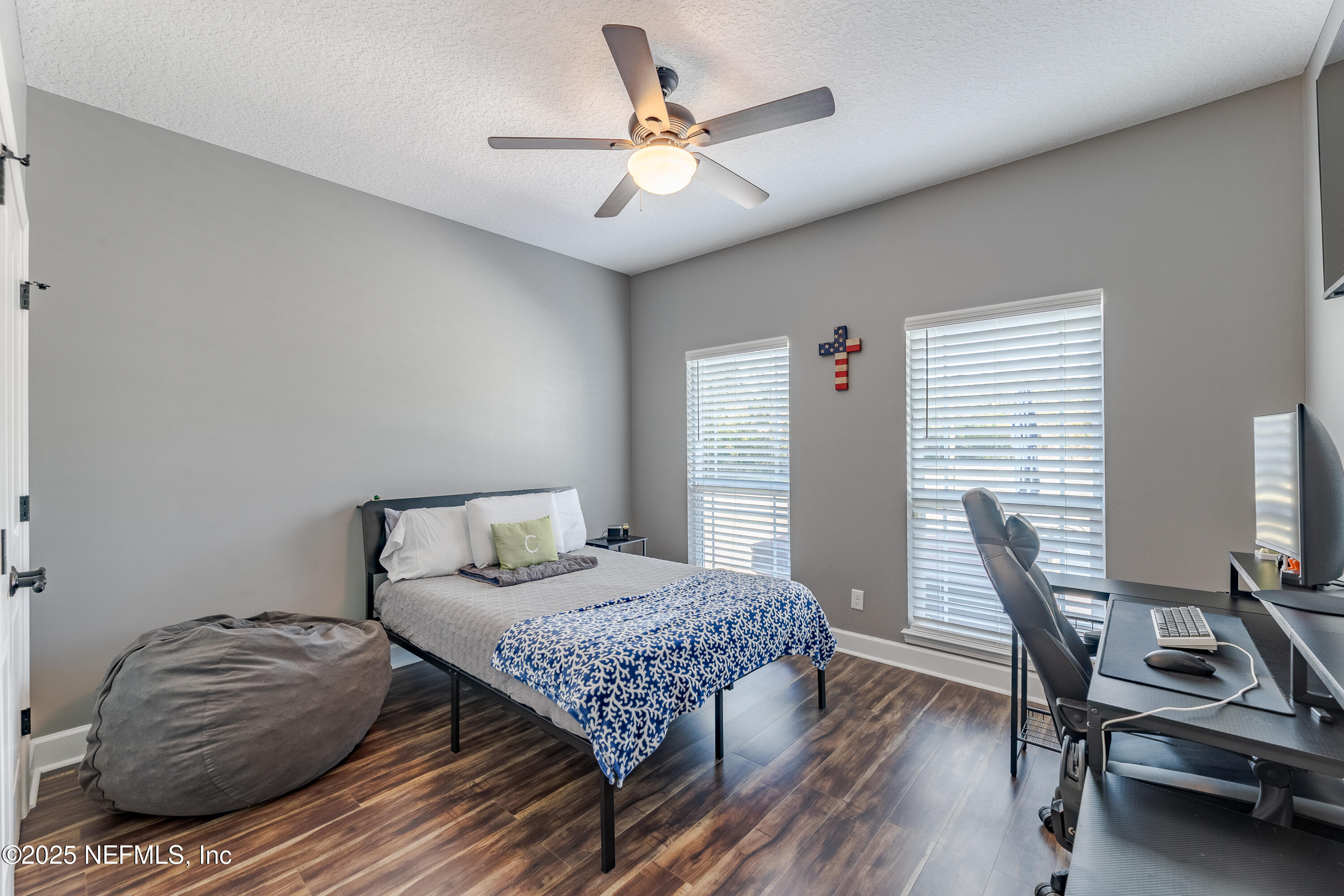 3670 Charles Green Road Hilliard, FL 32046 - Photo 29 of 68 a bedroom with a bed and a desk