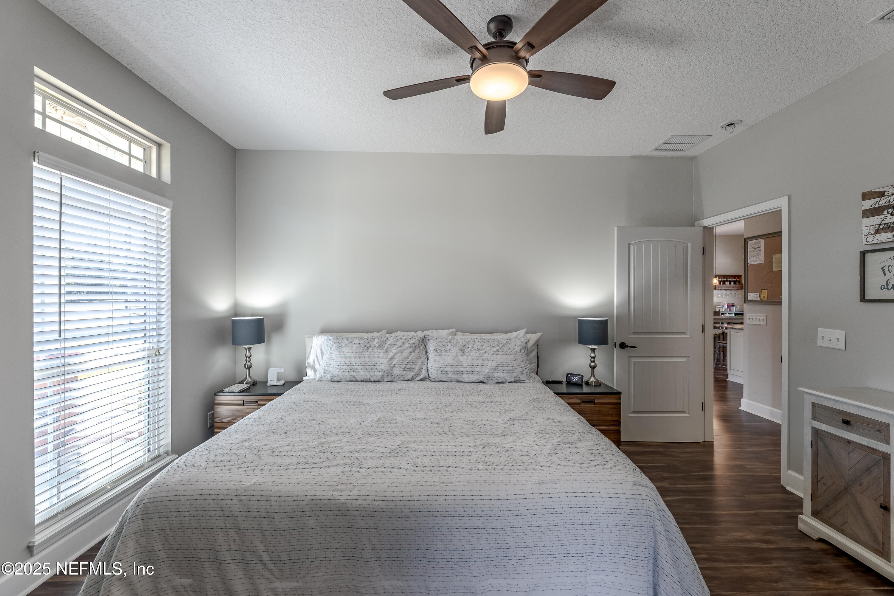 3670 Charles Green Road Hilliard, FL 32046 - Photo 32 of 68 a bedroom with a bed and a chandelier