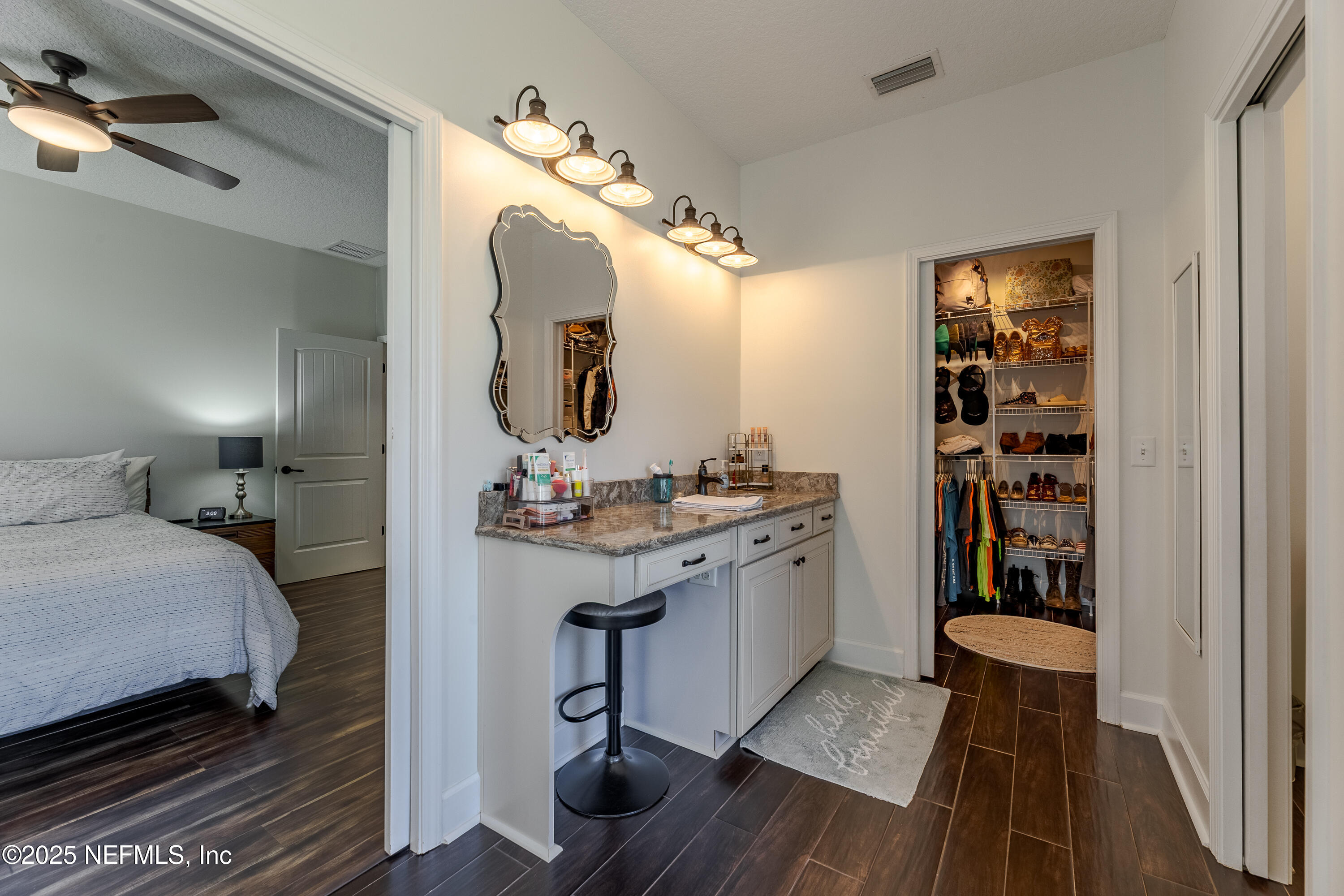 3670 Charles Green Road Hilliard, FL 32046 - Photo 34 of 68 a en suite bathroom with a double vanity sink and a mirror
