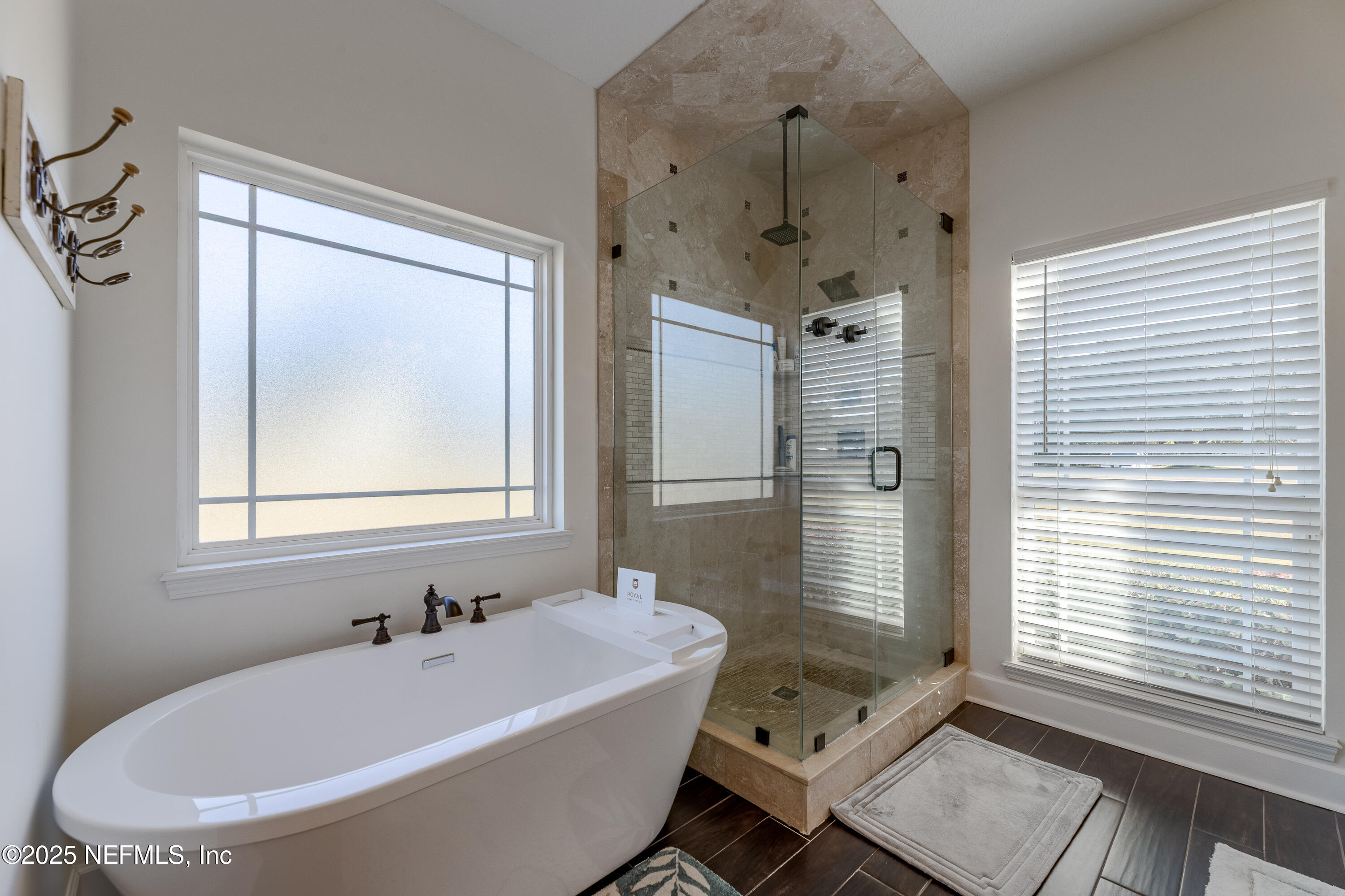 3670 Charles Green Road Hilliard, FL 32046 - Photo 36 of 68 a bathroom with a bathtub and a shower