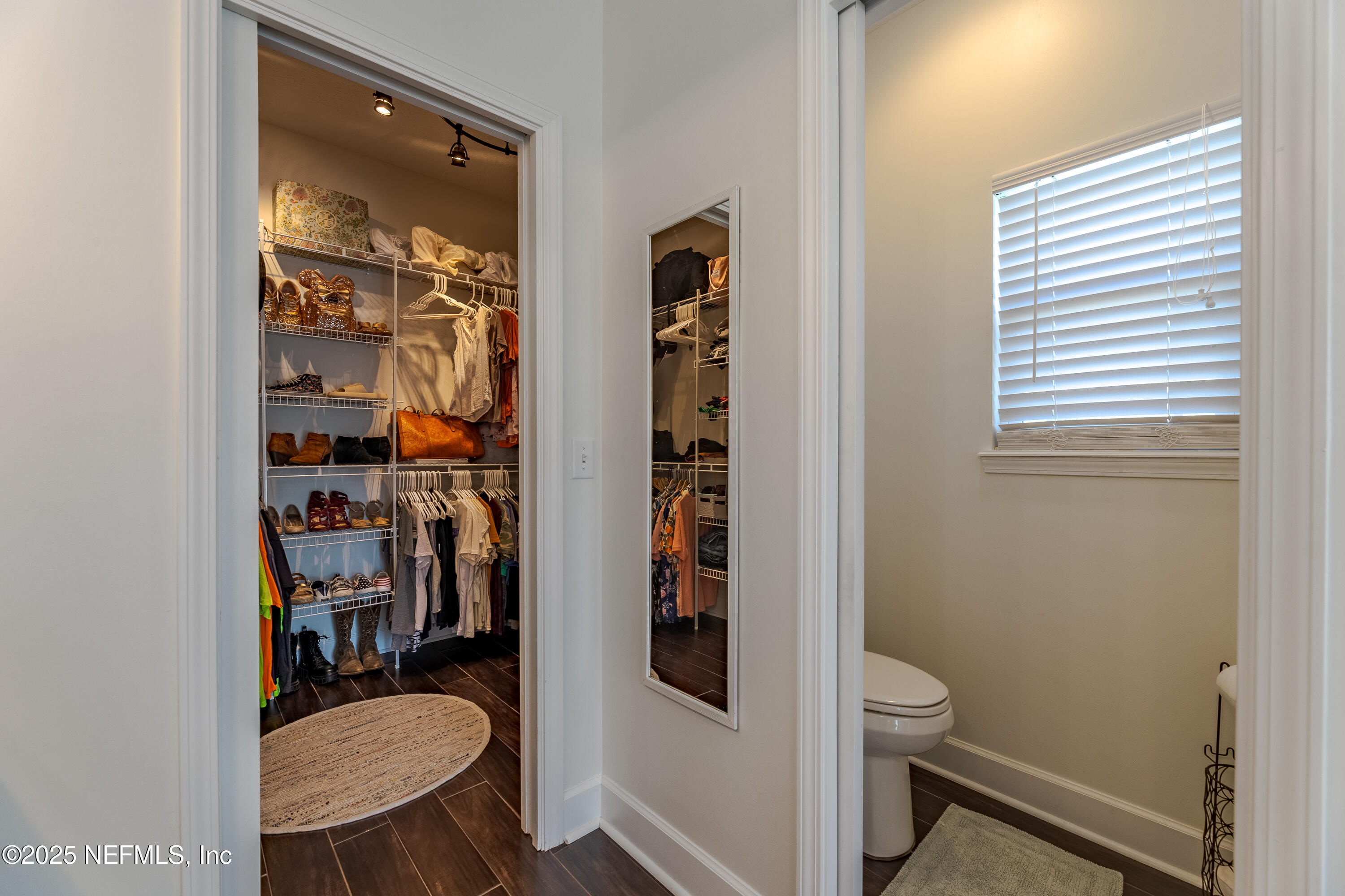 3670 Charles Green Road Hilliard, FL 32046 - Photo 37 of 68 a bathroom with a toilet and a shower curtain