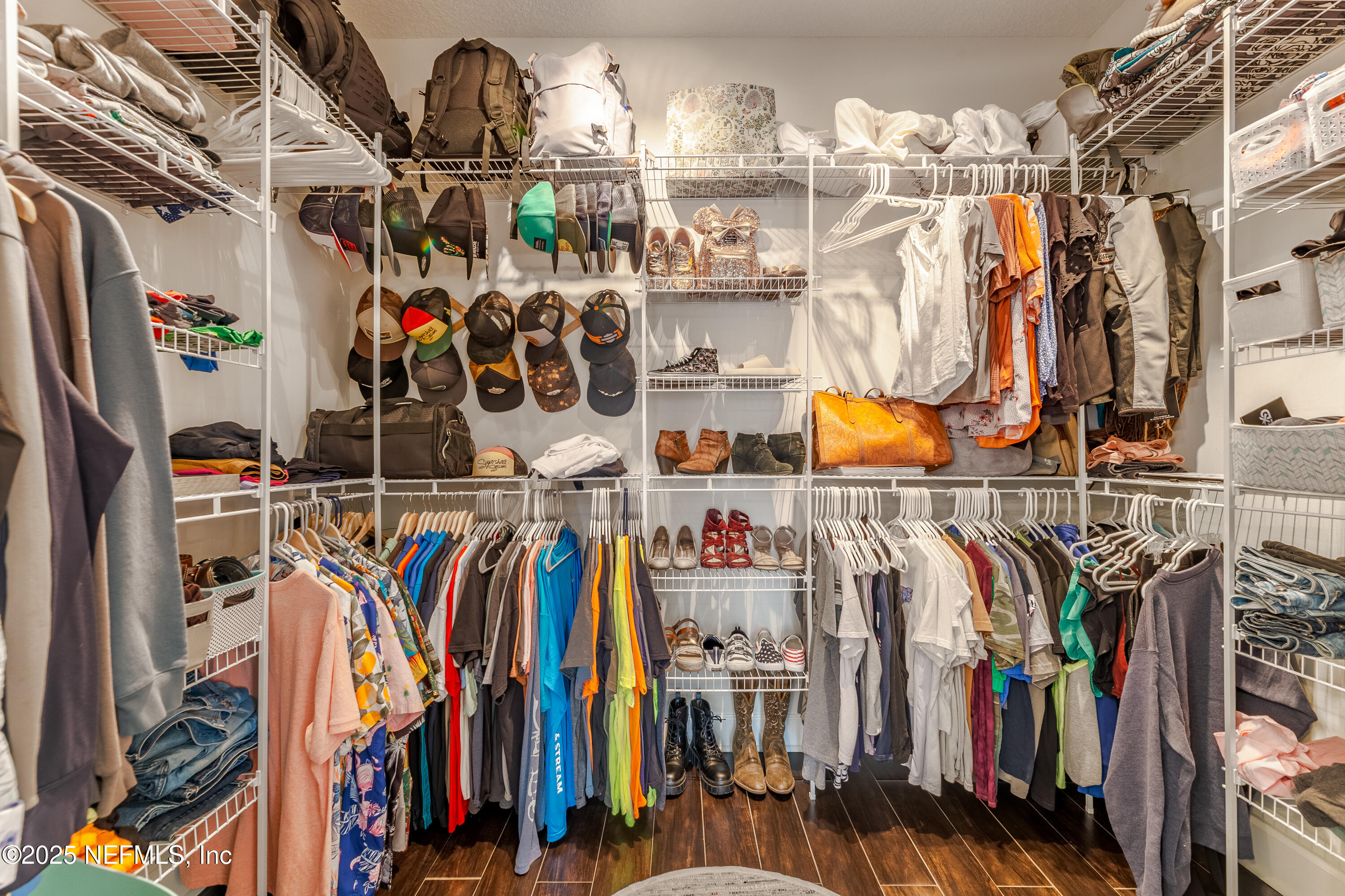 3670 Charles Green Road Hilliard, FL 32046 - Photo 38 of 68 a view of walk in closet with clothes