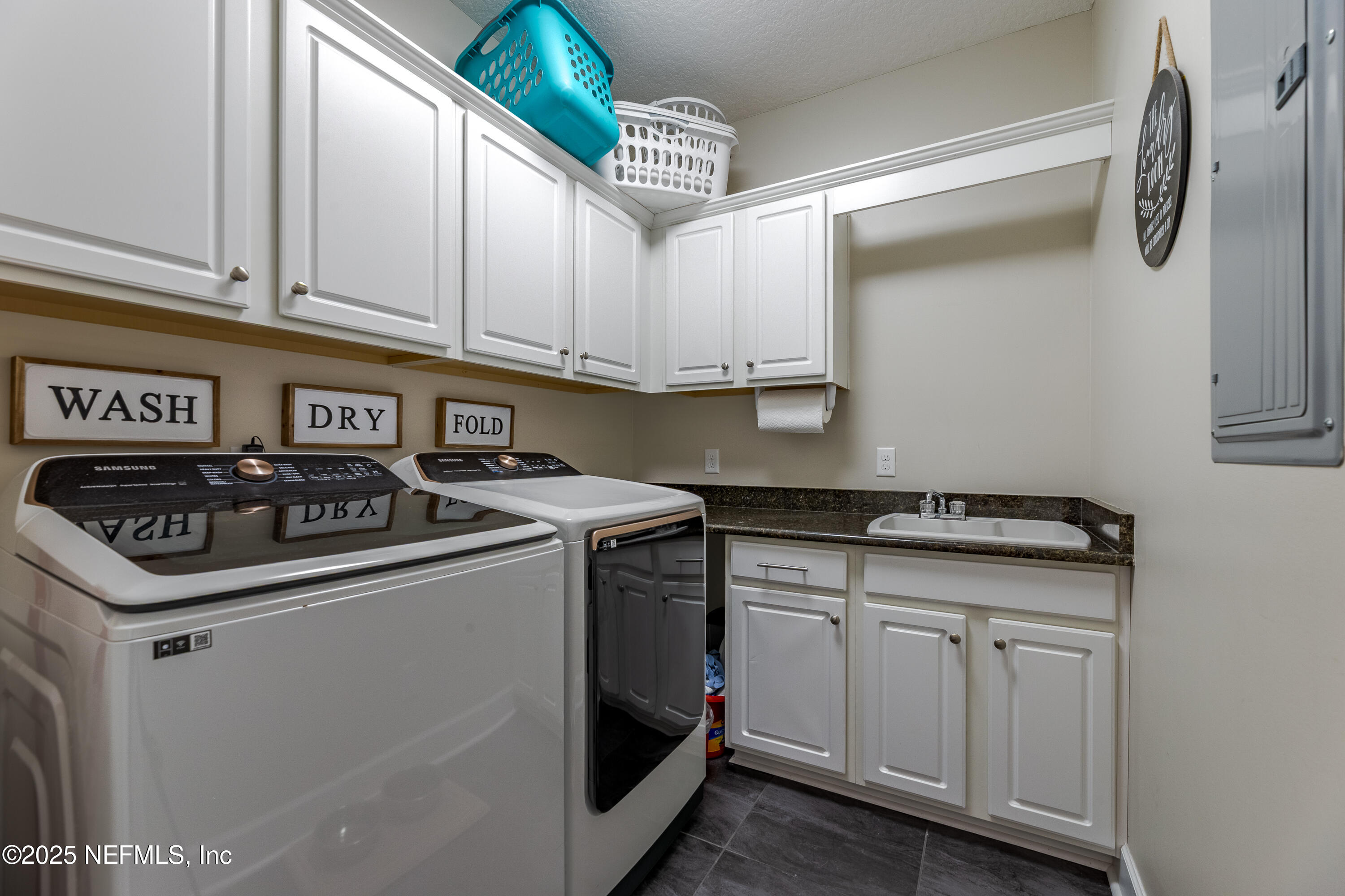 3670 Charles Green Road Hilliard, FL 32046 - Photo 39 of 68 a kitchen with granite countertop a sink and cabinets