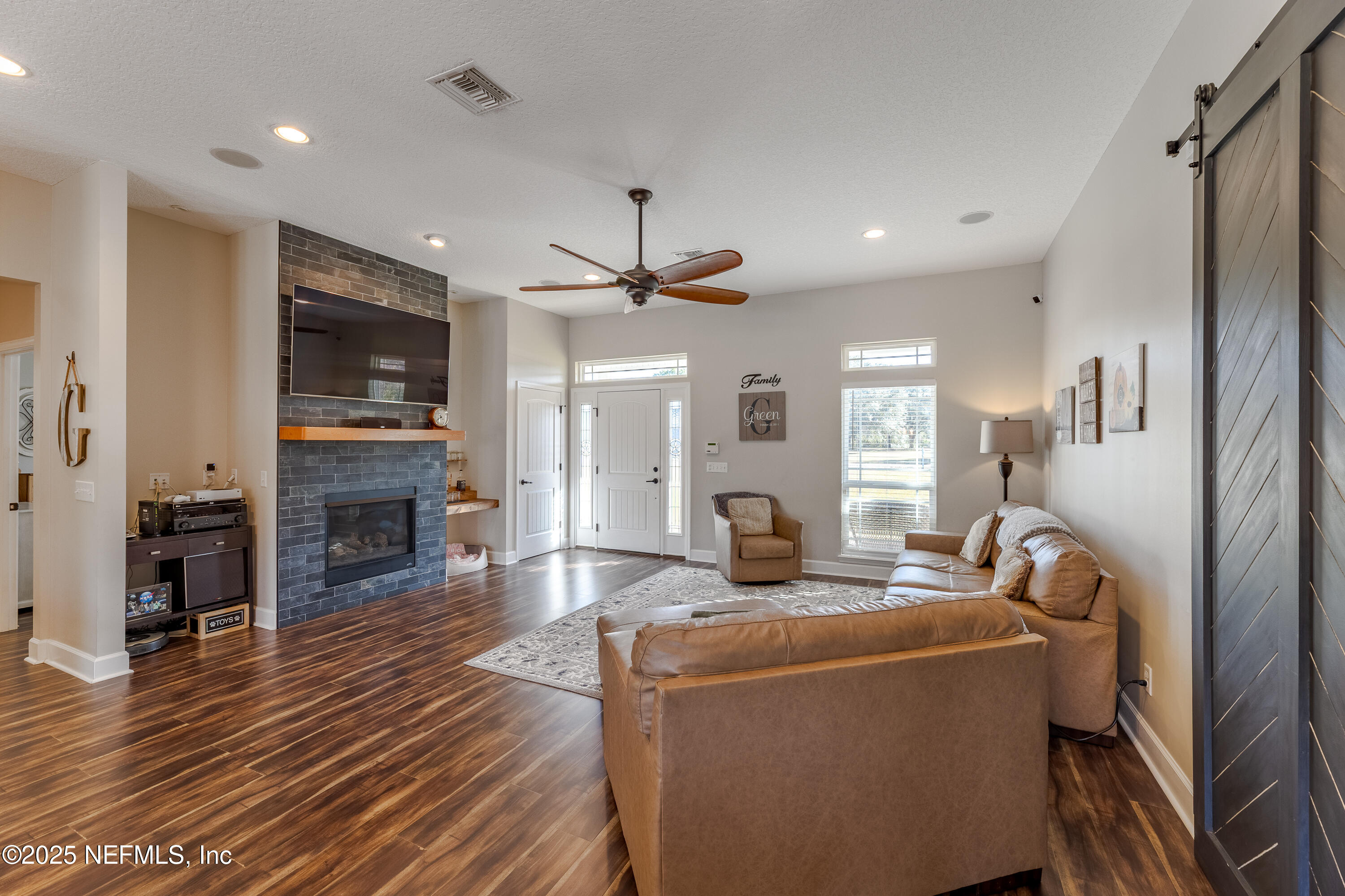 3670 Charles Green Road Hilliard, FL 32046 - Photo 4 of 68 a view of a dining room with furniture window and wooden floor