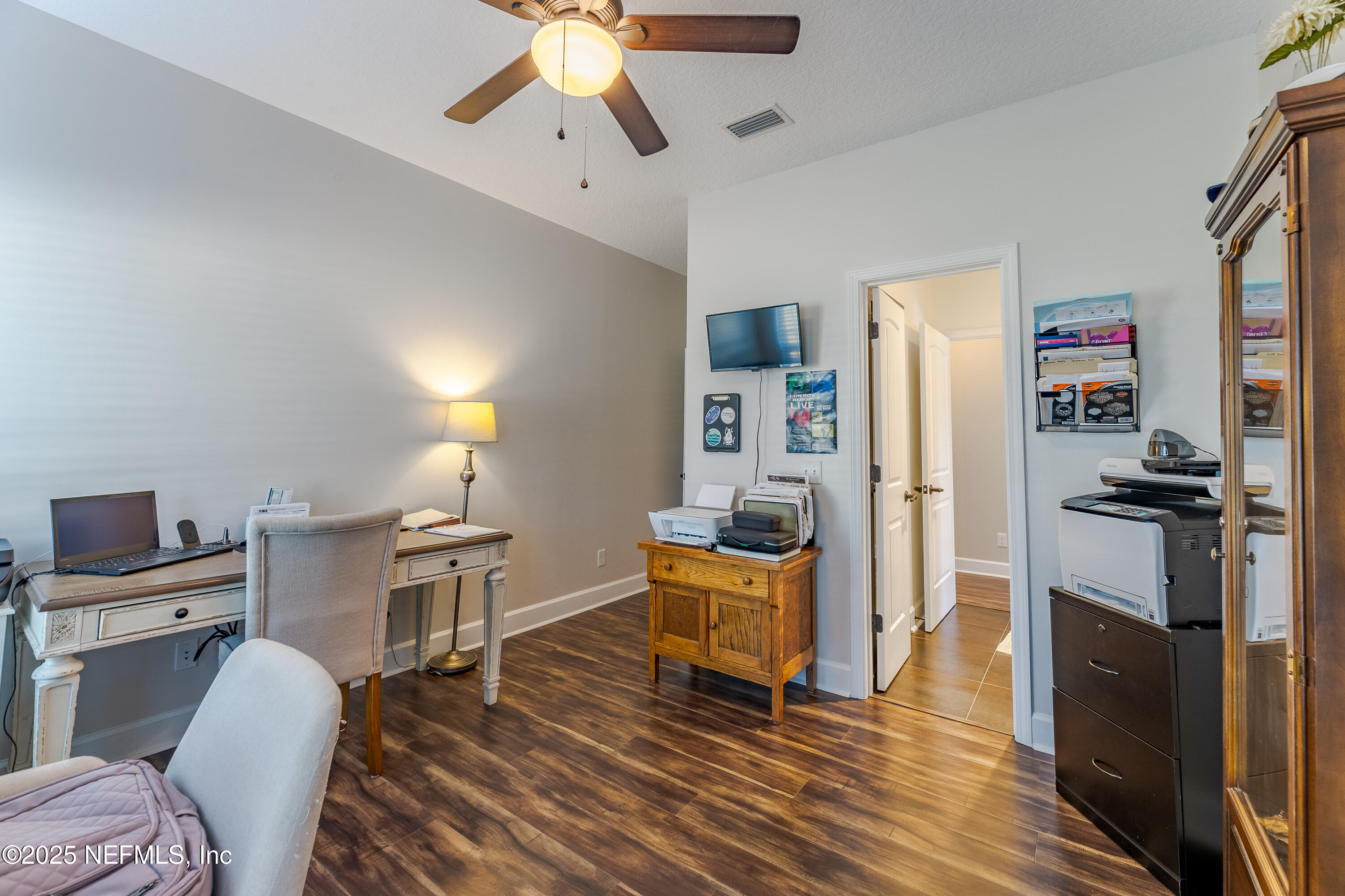 3670 Charles Green Road Hilliard, FL 32046 - Photo 41 of 68 a living room with furniture flat screen tv and wooden floor
