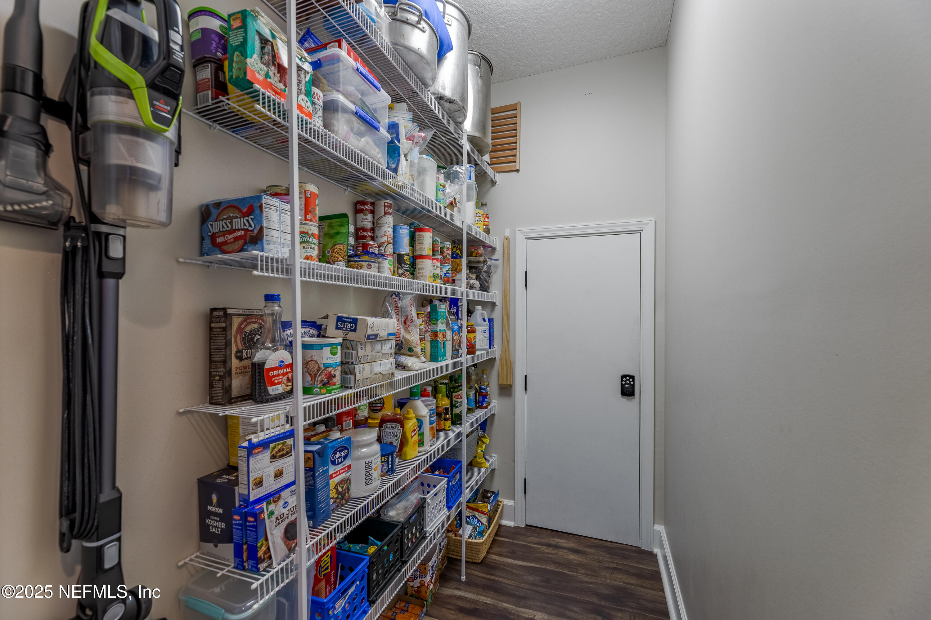 3670 Charles Green Road Hilliard, FL 32046 - Photo 45 of 68 a room with lots of books