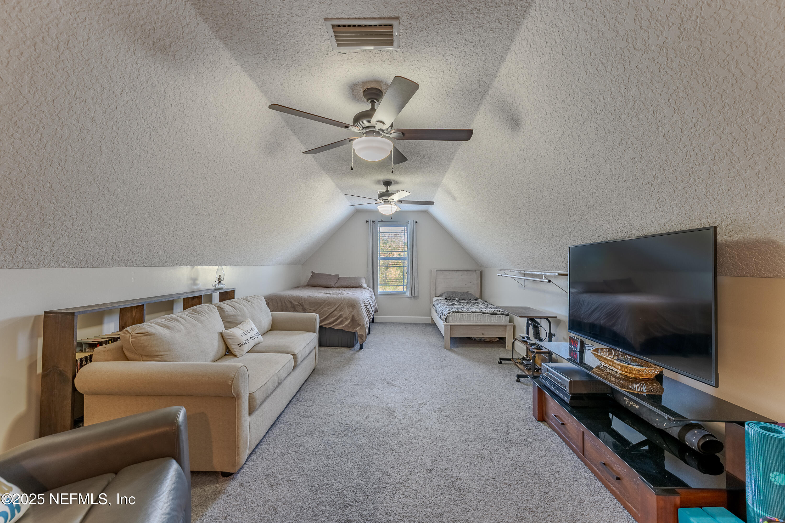 3670 Charles Green Road Hilliard, FL 32046 - Photo 51 of 68 a living room with furniture and a flat screen tv