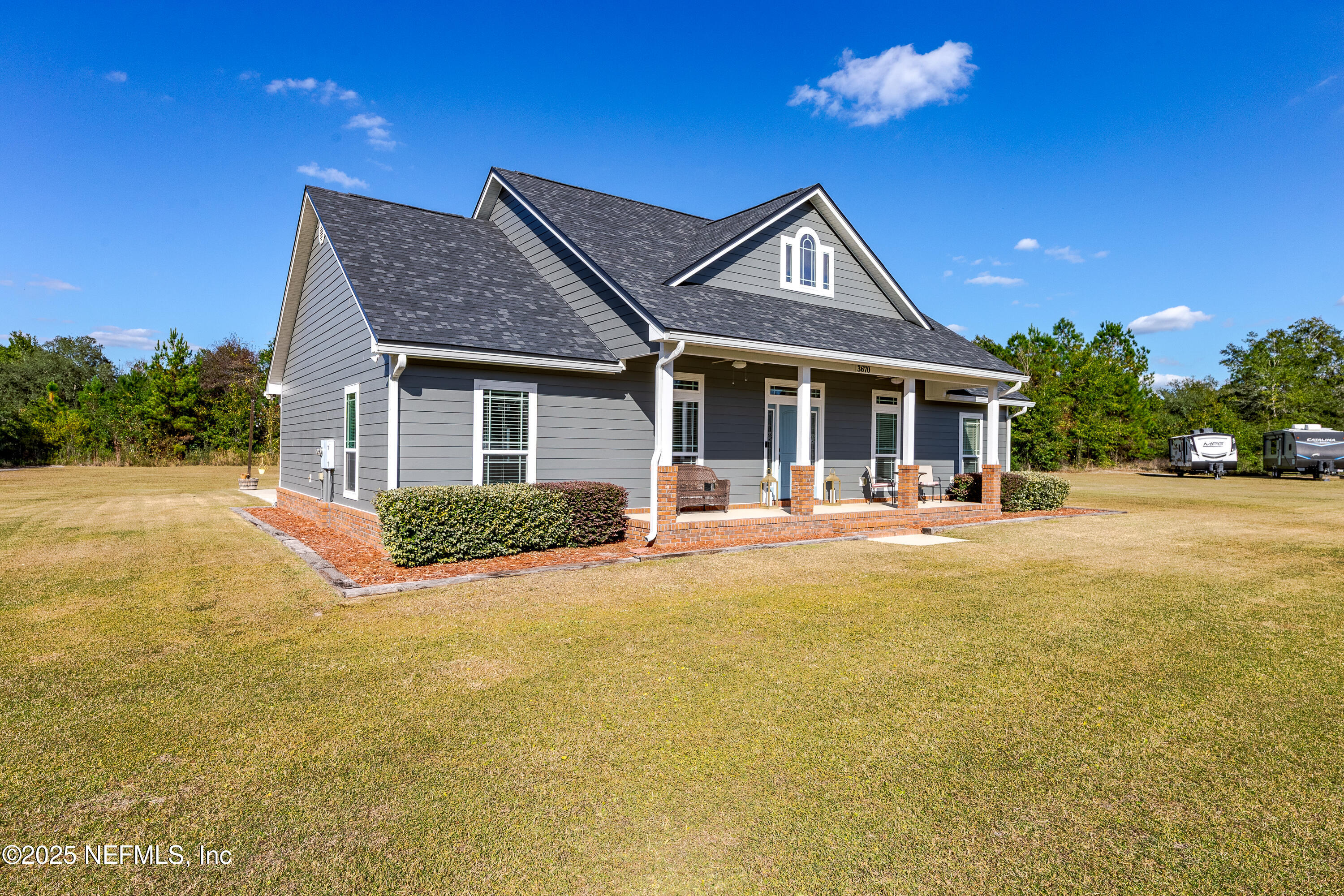 3670 Charles Green Road Hilliard, FL 32046 - Photo 60 of 68 a view of house with yard outdoor seating and entertaining space
