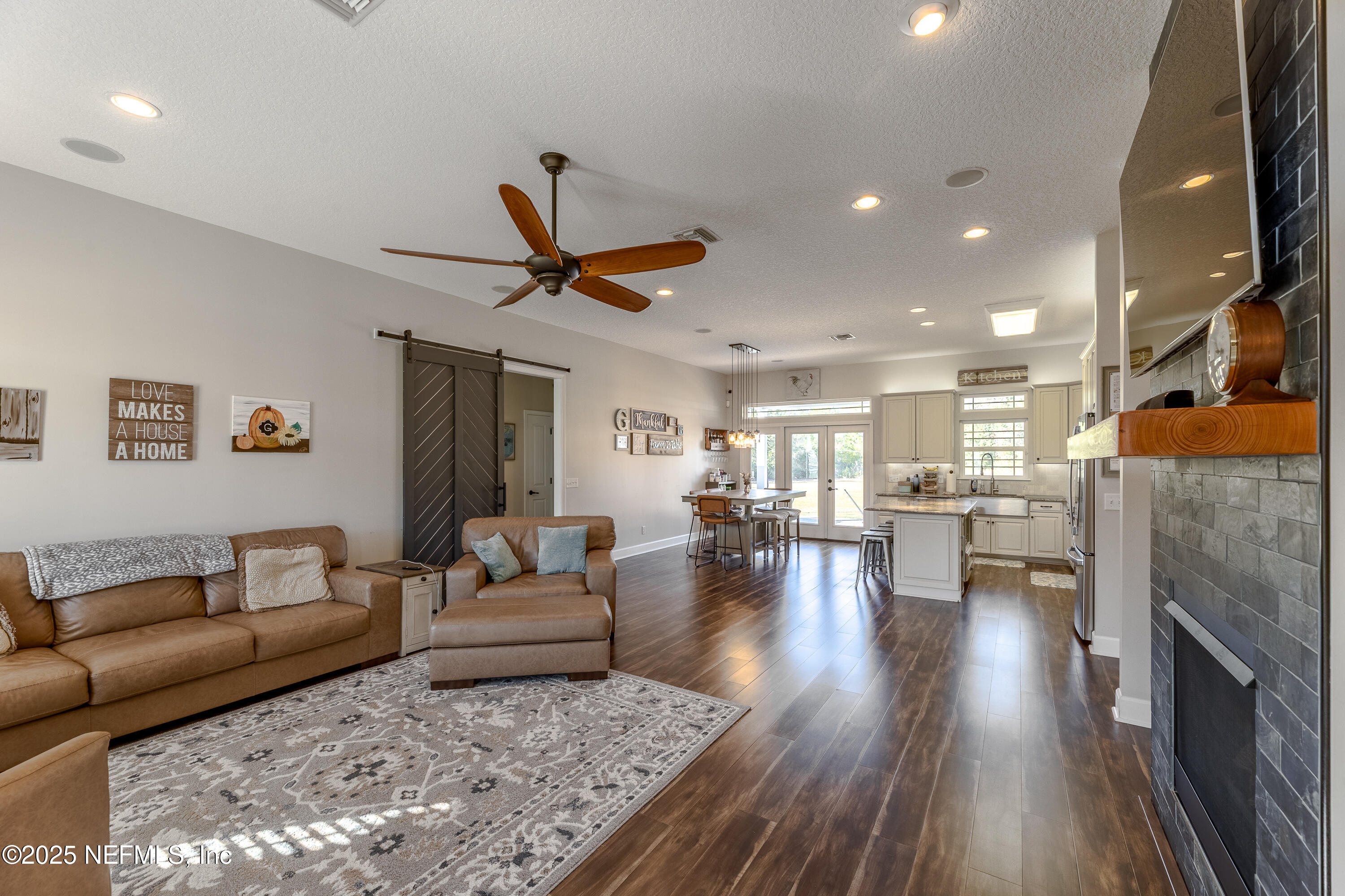 3670 Charles Green Road Hilliard, FL 32046 - Photo 7 of 68 a living room with furniture and kitchen view