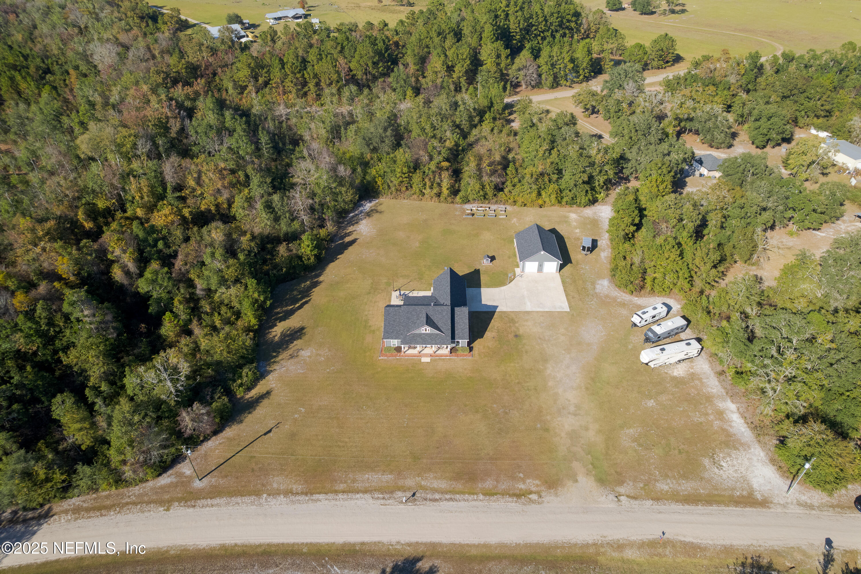 3670 Charles Green Road Hilliard, FL 32046 - Photo 8 of 68 an aerial view of a house with yard