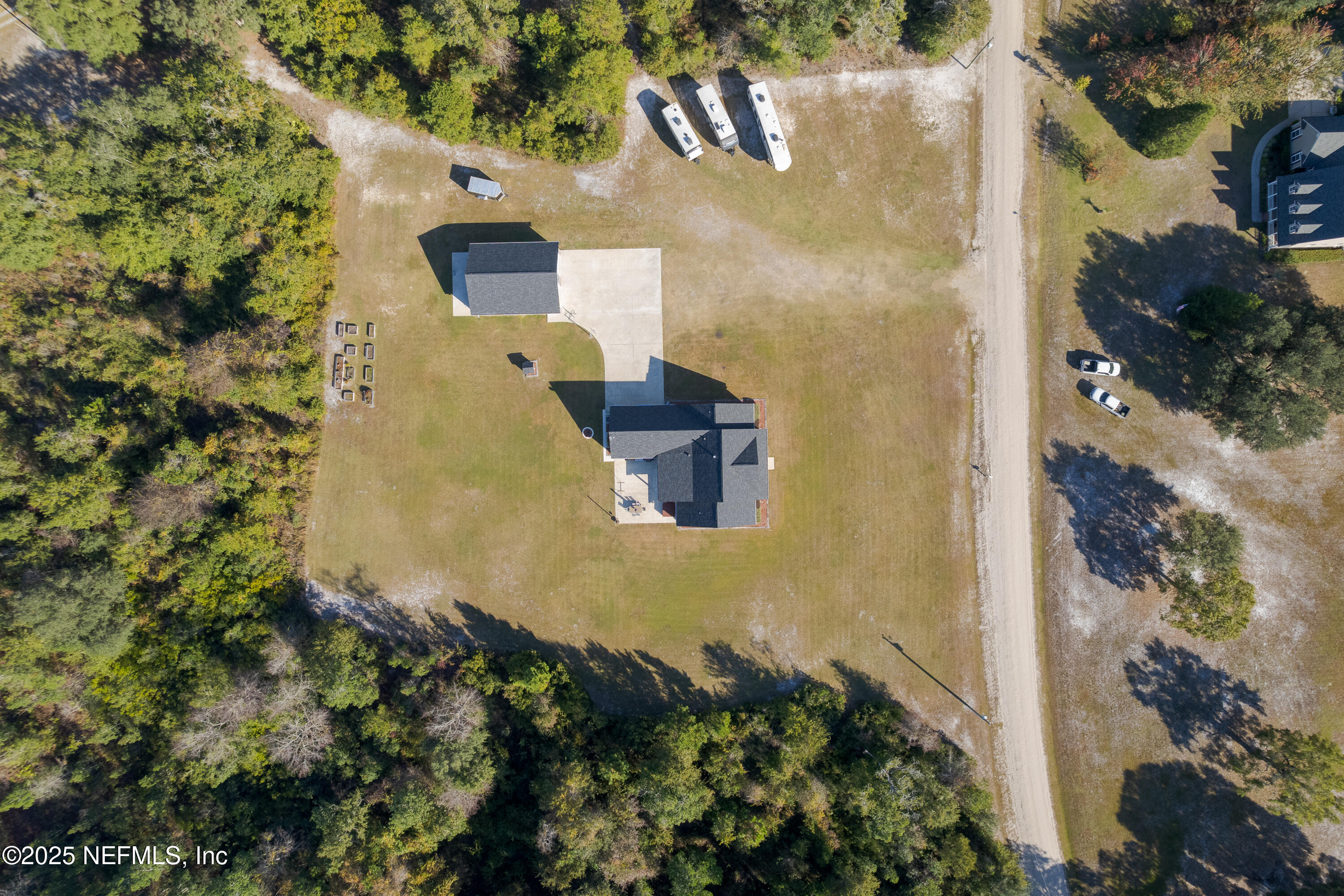 3670 Charles Green Road Hilliard, FL 32046 - Photo 9 of 68 an aerial view of a house with a yard