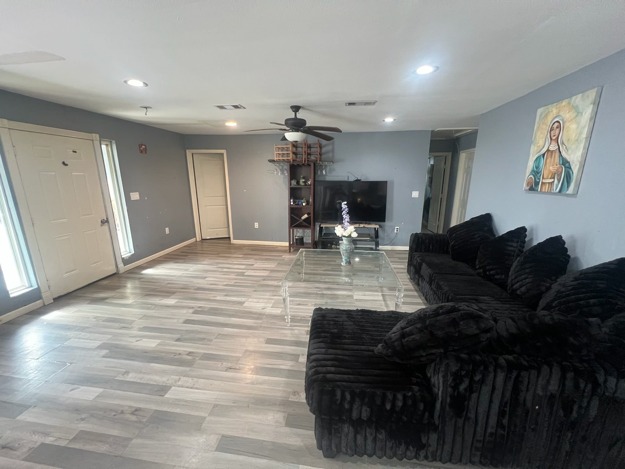 221 Calloway Street Houston, TX 77029 - Photo 5 of 9 a living room with furniture and a chandelier