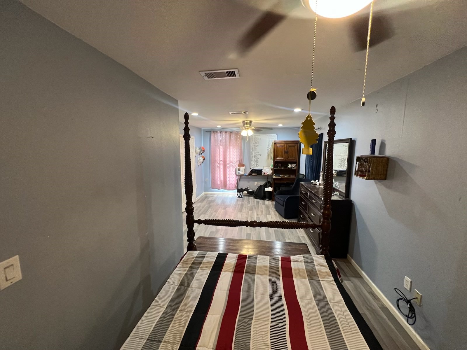 221 Calloway Street Houston, TX 77029 - Photo 8 of 9 a hallway with a large mirror and a sink