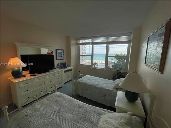a bedroom with furniture and windows