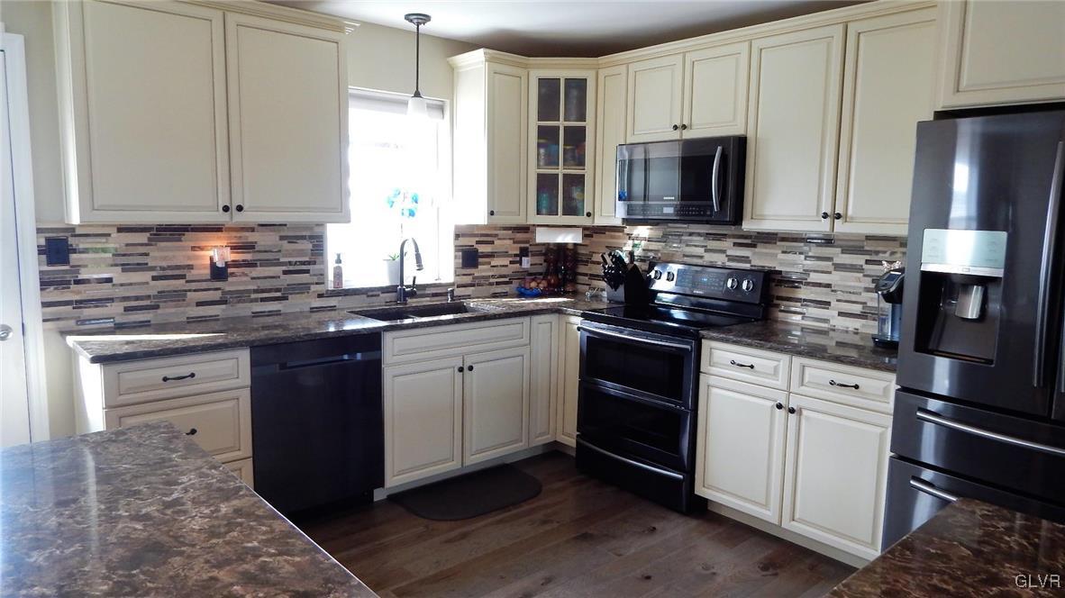 1160 Newlins Road West Easton, PA 18040 - Photo 5 of 12 a kitchen with stainless steel appliances granite countertop a stove a sink dishwasher and a refrigerator