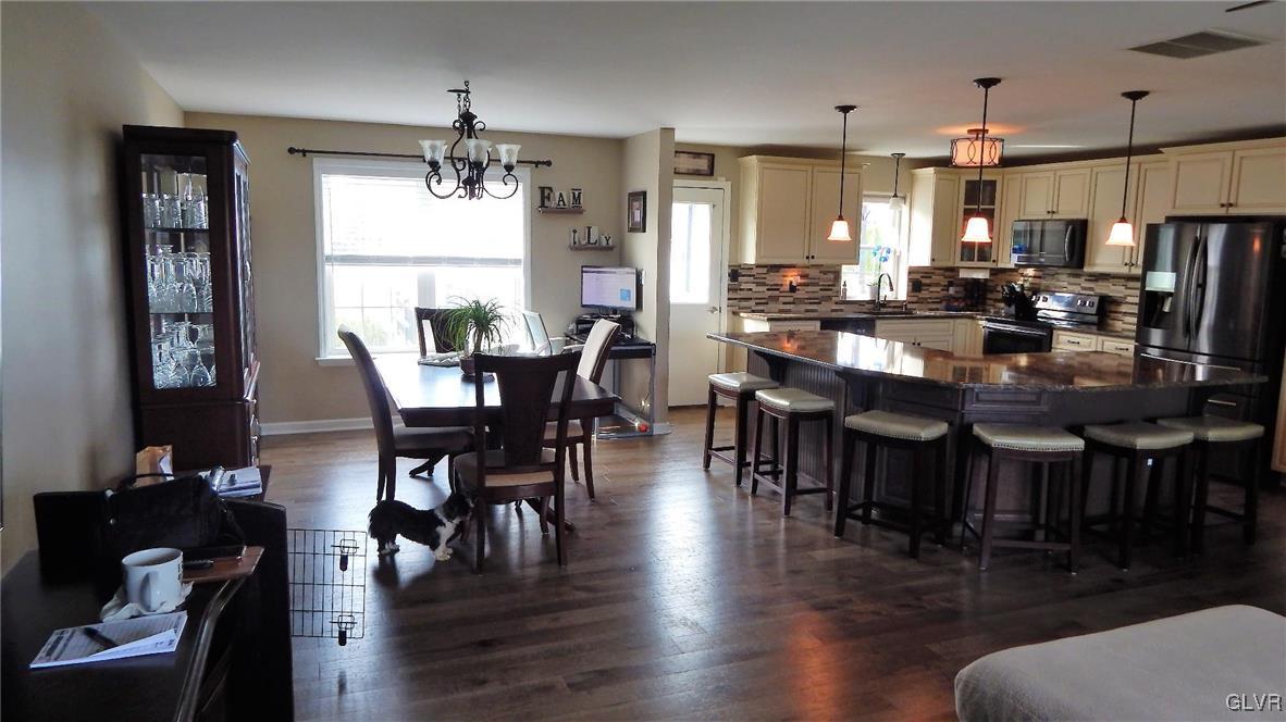 1160 Newlins Road West Easton, PA 18040 - Photo 6 of 12 a view of a dining room with furniture window and wooden floor