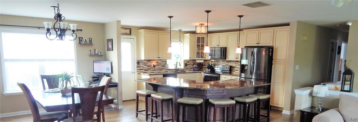 1160 Newlins Road West Easton, PA 18040 - Photo 7 of 12 a large kitchen with a table and chairs