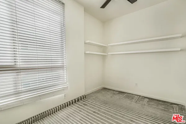 a view of a room that has a window