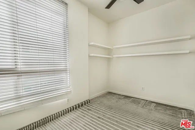 a view of a room that has a window