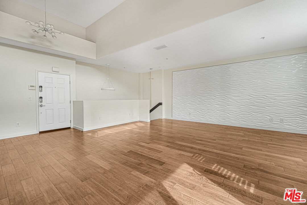 13044 Pacific Promenade, Unit 417 Playa Vista, CA 90094 - Photo 6 of 31 a view of empty room with wooden floor