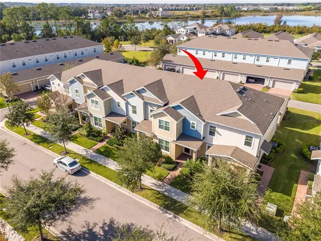 an aerial view of residential houses with outdoor space