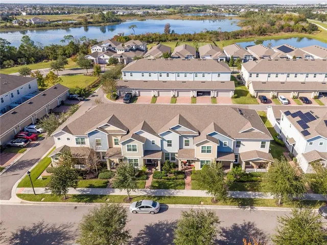 an aerial view of residential houses with outdoor space