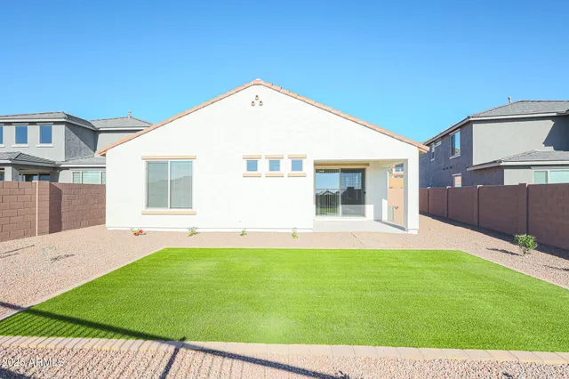 a view of a backyard with a garden and plants