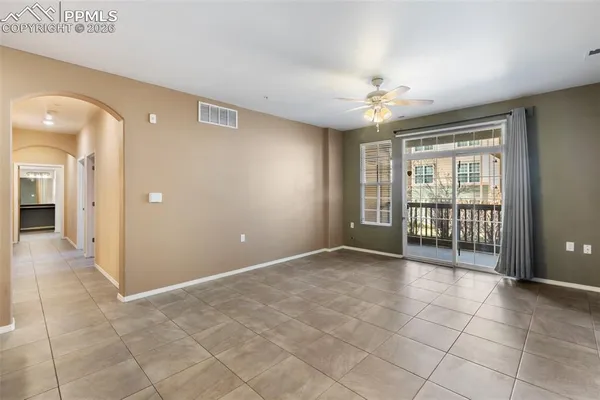 a kitchen with a sink a counter space and chandelier