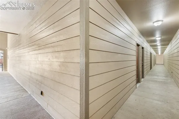 a view of a room with racks on the wall