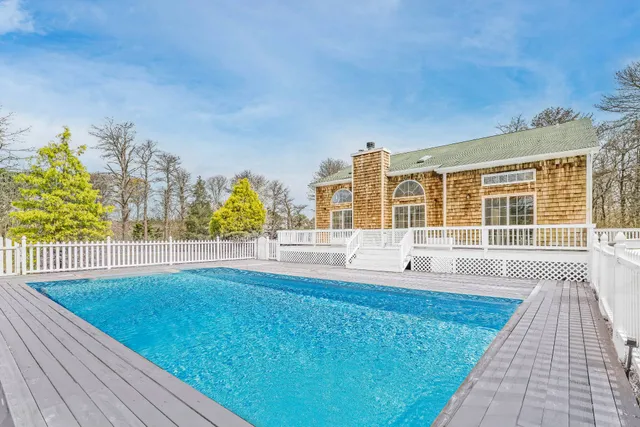 a view of swimming pool with outdoor space and seating area
