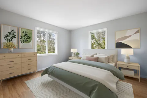 a bedroom with a bed and a window