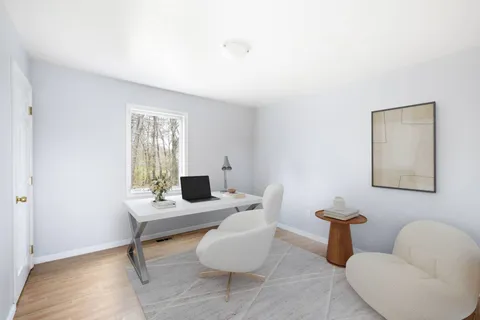 a room with a couch and a window