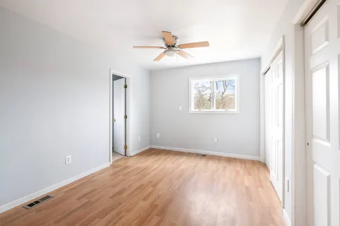 a view of a livingroom with wooden floor