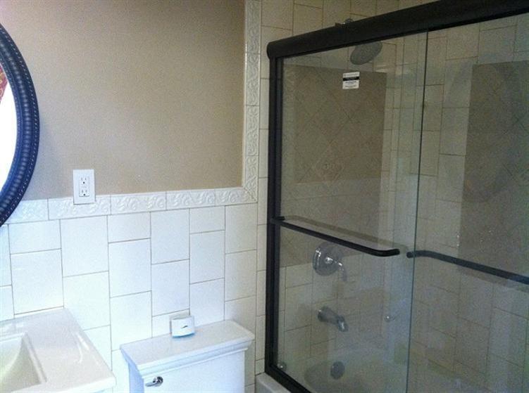 5 Blueberry Road Buzzards Bay, MA 02532 - Photo 13 of 28 a bathroom with a bathtub and shower