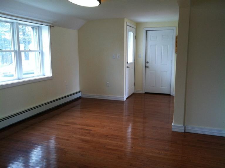 5 Blueberry Road Buzzards Bay, MA 02532 - Photo 8 of 28 an empty room with wooden floor and windows