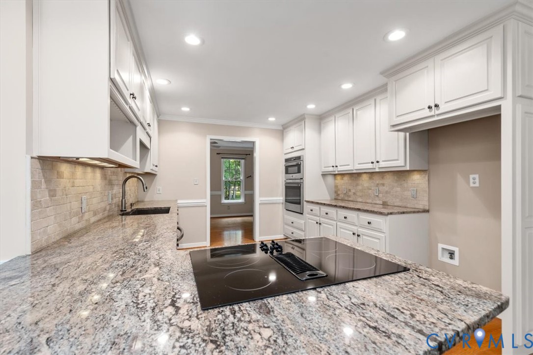 1437 Palmore Road Powhatan, VA 23139 - Photo 15 of 60 Modern kitchen featuring light-toned cabinetry, sp